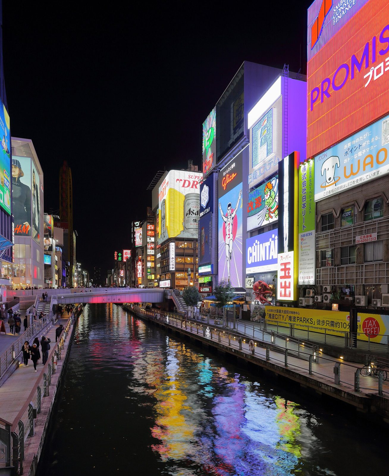 The Dotonbori canal lit by neon at night