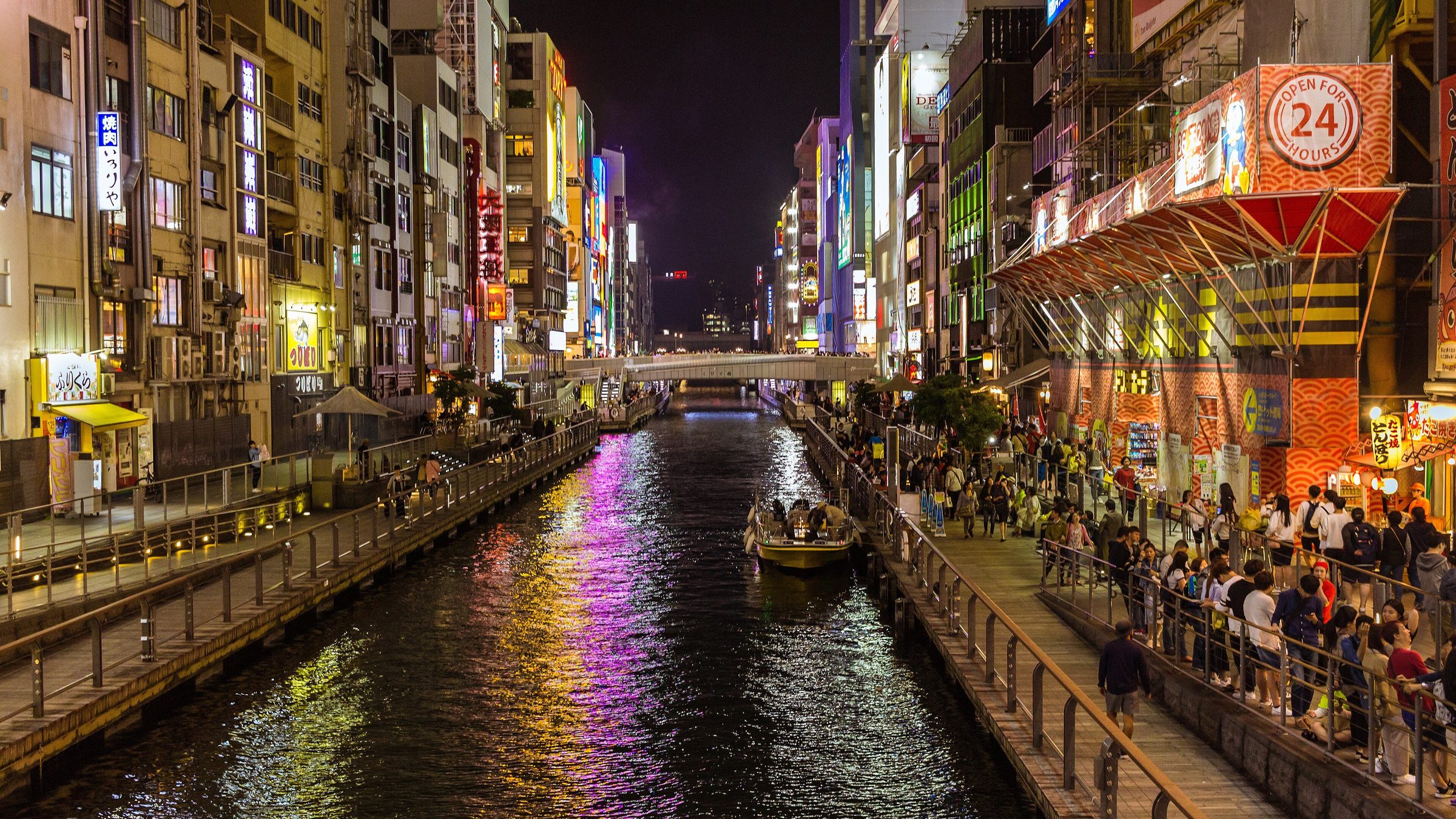 The neon signs of Dotonbori reflected in the canal at night