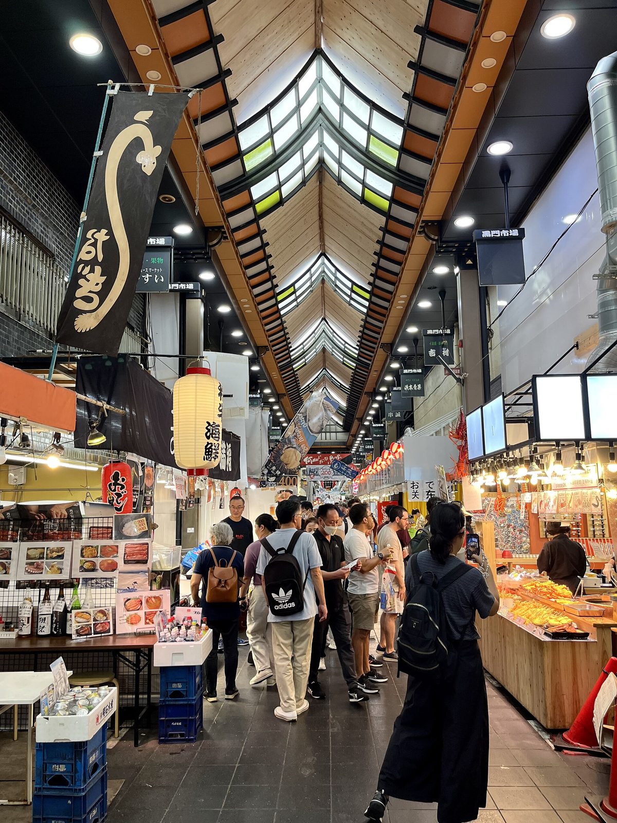 Shoppers in Kuromon Ichiba market