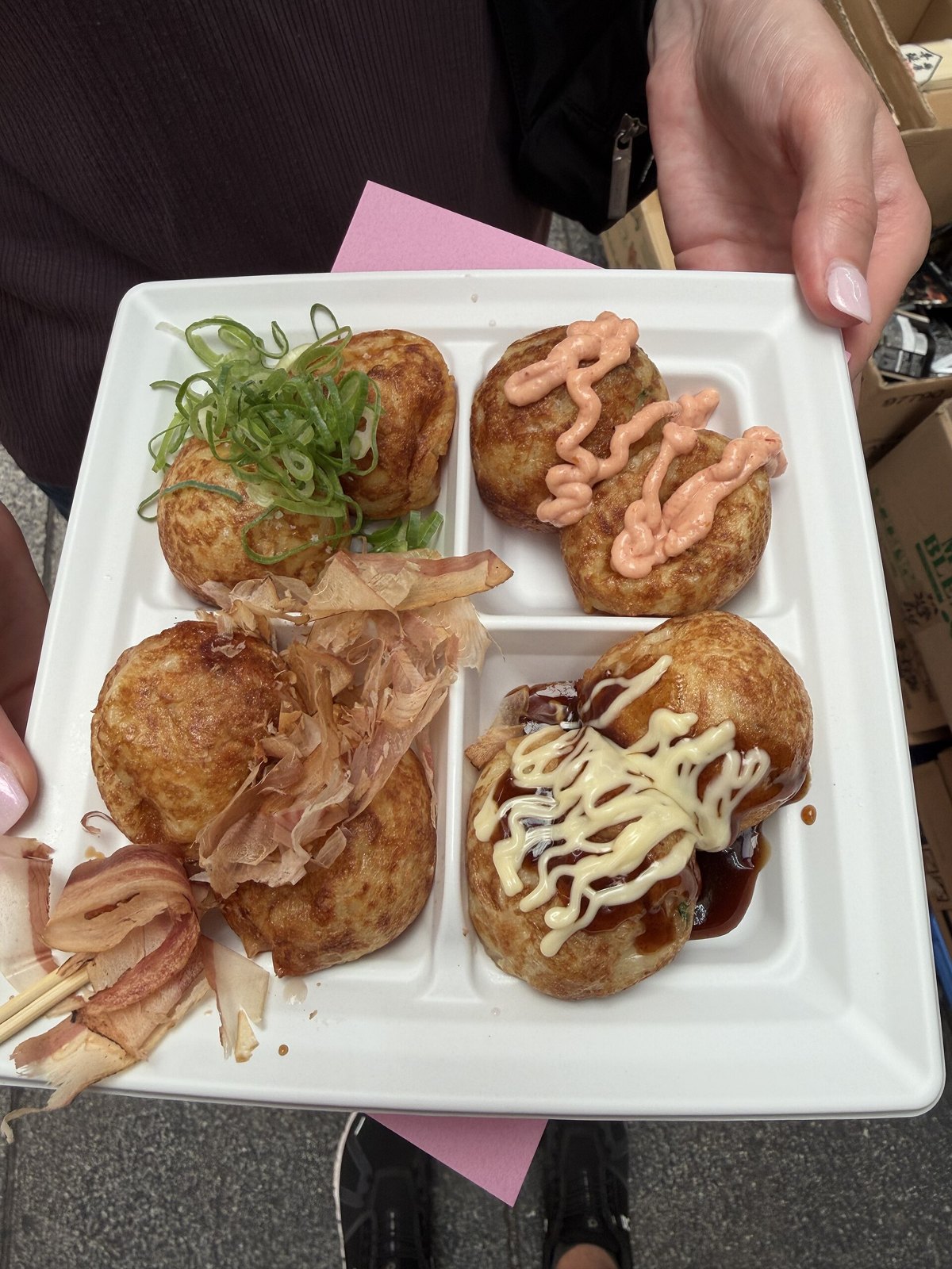 A plate of assorted Takoyaki in Kuromon Market in Osaka, Japan